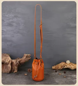 Handmade leather bucket bag, vintage drawstring mini crossbody shoulder bag for women.