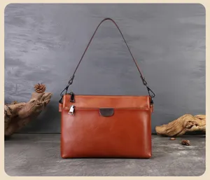 Genuine leather women's underarm shoulder bag detail view showing multi-layer design and hardware