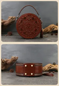 Vintage embossed round leather handbag top handle shoulder crossbody bag with carved pattern.