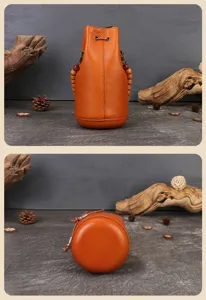 Handmade vegetable tanned leather bucket bag detail view, vintage drawstring shoulder bag.
