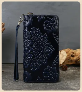 Dark blue embossed genuine cowhide women long wallet with wrist strap and vintage floral pattern.