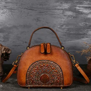 Vintage genuine leather handbag top handle shoulder bag with exquisite embossed pattern detail.