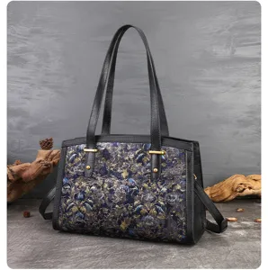 Detailed view of women's vintage ethnic embroidered shoulder bag, large capacity PU leather tote.