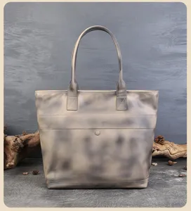 Retro genuine leather tote bag detail view, large capacity vintage shoulder bag craftsmanship.