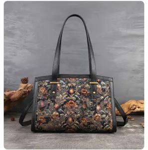 Detailed view of the vintage embroidered shoulder bag with elegant black leather trim.