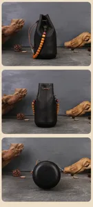 Detailed view of handmade genuine leather bucket bag with wooden bead strap and drawstring.