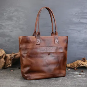 Vintage leather tote bag for women, large capacity shoulder bag for daily commuting and travel.
