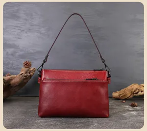 Red genuine leather multi-layer shoulder bag, versatile underarm bag with zipper details.