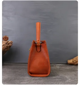 Orange vintage leather handbag side view minimalist elegant style women shoulder tote bag