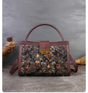 Vintage floral tapestry handbag with leather trim and top handle for women's elegant fashion.