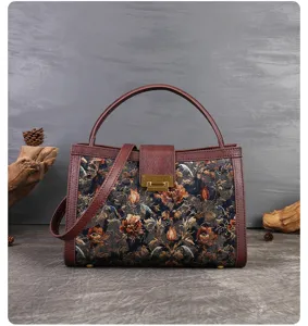 Vintage embroidered floral handbag detail showing exquisite brocade fabric and metal clasp