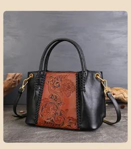 Handmade genuine leather carved retro handbag detail, vintage embossed floral pattern shoulder bag.