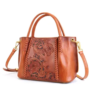 Vintage genuine leather carved tote bag with braided handles and distressed retro finish main view