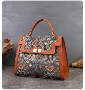 Vintage floral embroidered leather splicing top handle handbag for elegant daily commute.