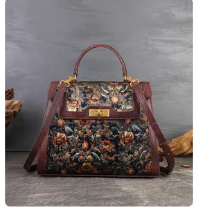 Retro floral embroidered handbag detail showcasing exquisite stitching and metal turn-lock closure.