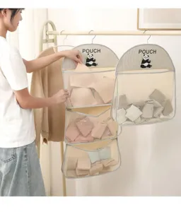 Detailed view of the hanging mesh storage organizer bag with multi-layer design.