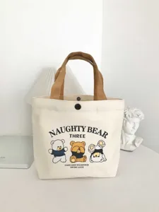 Small canvas tote bag with cute cartoon bear print and brown handles for daily use