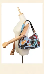 Close-up detail of the vintage patchwork shoulder bag showing texture and color variety.
