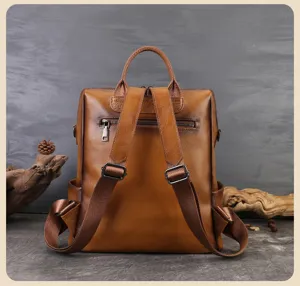 Detail view of brown leather casual backpack, lightweight commuting daypack with straps.