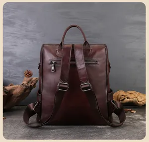 Dark brown leather backpack for women, stylish casual daypack with multiple compartments.