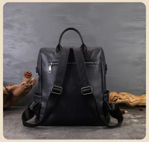 Black leather women backpack detail view, large capacity casual commuting school bag design.