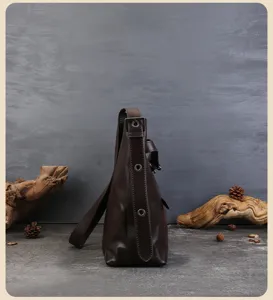 Dark brown leather hobo shoulder bag side detail, casual commuting retro tote design.