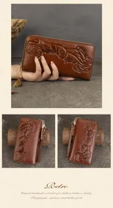 Cartera larga de cuero genuino para mujer con relieve floral vintage y colgante de borla.
