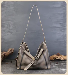 Close-up detail of the vintage genuine leather hobo shoulder bag with retro lock design.