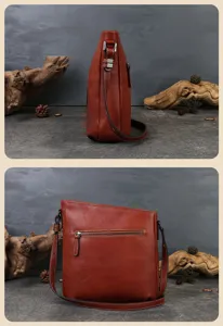 Detailed view of brown leather shoulder bag, showcasing fine stitching, zipper pocket and texture.