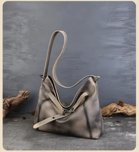Detailed view of the vintage cowhide hobo shoulder bag with unique lock design for daily commute.