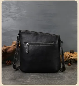 Black genuine leather shoulder bag for women, retro sloped design with zipper pocket.