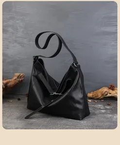 Black genuine leather hobo shoulder bag for women, casual commuter tote with long strap.