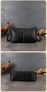 Detailed view of black cowhide underarm bag showing fine stitching and smooth bottom structure.