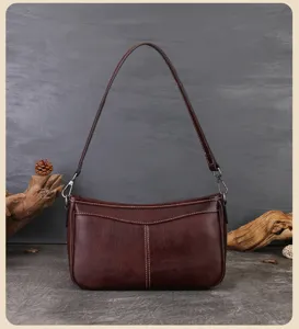 Retro top layer cowhide leather underarm shoulder bag, stylish vintage baguette handbag for women.