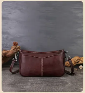 Detailed view of the retro brown leather underarm bag showcasing fine stitching and premium leather texture.