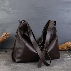 Dark brown leather hobo shoulder bag for women, large capacity commuting crossbody bag.