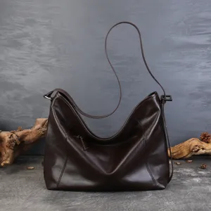Premium top-layer cowhide leather hobo shoulder bag, large capacity slouchy commuter tote for women.