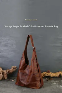 Retro brown genuine leather hobo shoulder bag showcasing premium cowhide material detail.