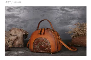 Vintage genuine leather top-handle crossbody bag with ethnic embossed mandala pattern.