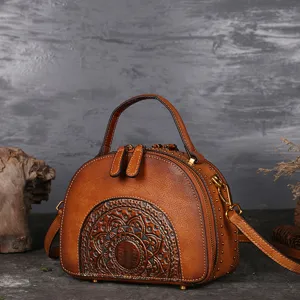 Vintage genuine leather handbag for women, retro brown ethnic embossed cowhide shoulder bag.