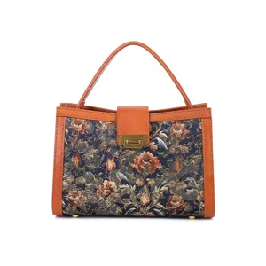 Vintage floral tapestry top handle handbag with brown leather trim. Women fashion shoulder bag.
