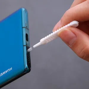 Mini cleaning brush for phone ports and nozzle gaps, flexible tool with anti-slip handle.