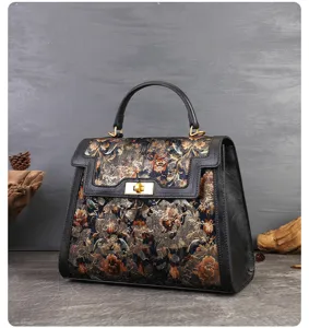 Vintage floral embroidered top handle bag detail, elegant leather spliced commuting shoulder bag.