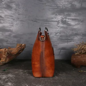 Vintage genuine cowhide leather handbag for women, large capacity side view main product shot.