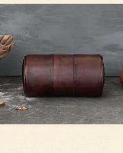 Genuine leather cylinder crossbody bag detail view, vintage retro pillow bag for women.