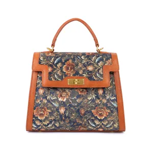 Vintage floral embroidered top-handle bag with leather trim, elegant commute handbag for women.