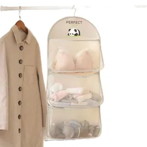 Hanging storage bag with 3 breathable mesh pockets for wardrobe bedroom door organization.