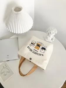 Small canvas tote bag with cute bear print and brown handle, minimalist casual daily handbag.