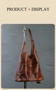 Vintage brown leather tote shoulder bag detail showing premium cowhide leather texture.