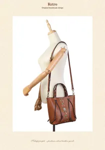 Genuine leather bucket bag with retro woven handles, studs, and adjustable strap for women.